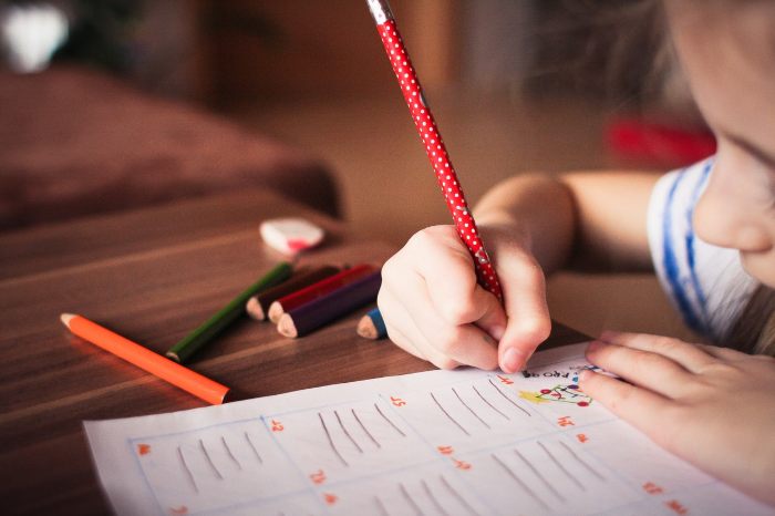 Child writing on paper