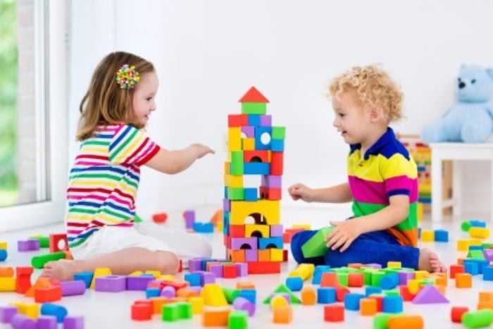 kid playing with blocks