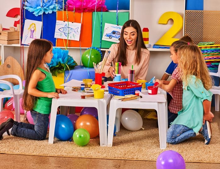 Teacher doing art with children