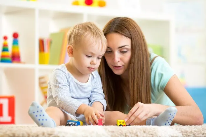 Mom playing with toddler