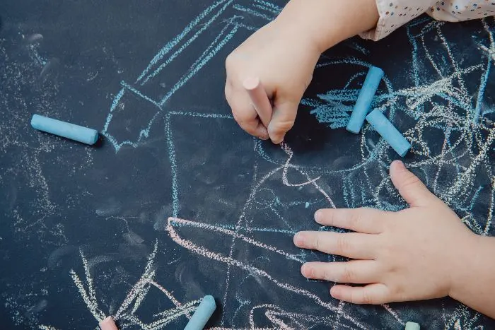 Drawing on a blackboard with chalk