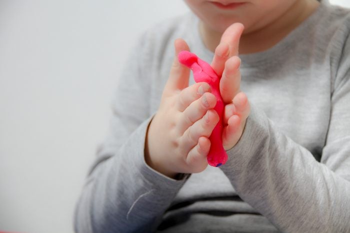 Child playing with playdough