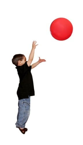 Child catching a large ball