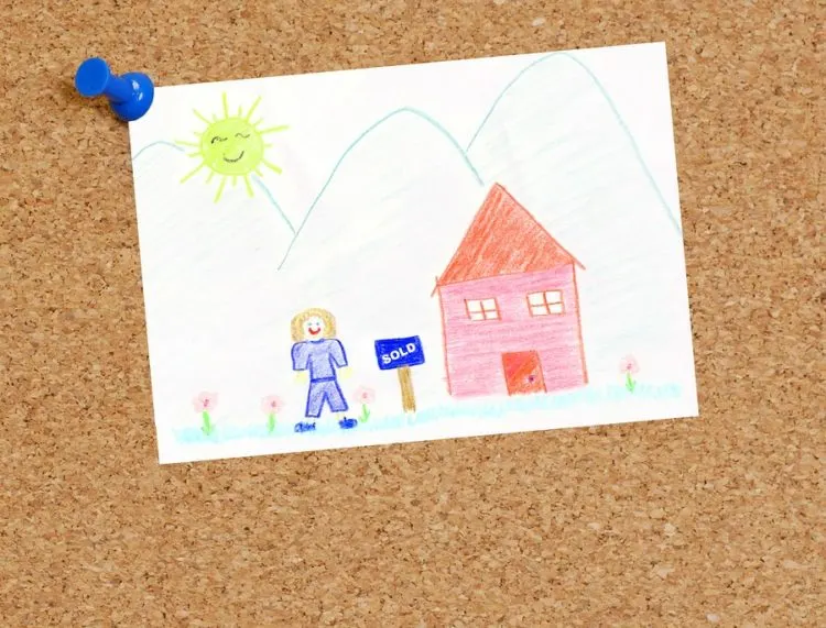 Child's drawing displayed on pin board