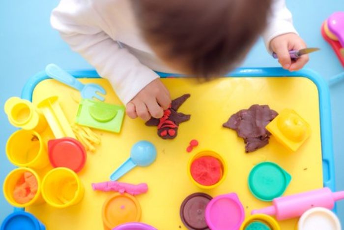 Child playing with playdough