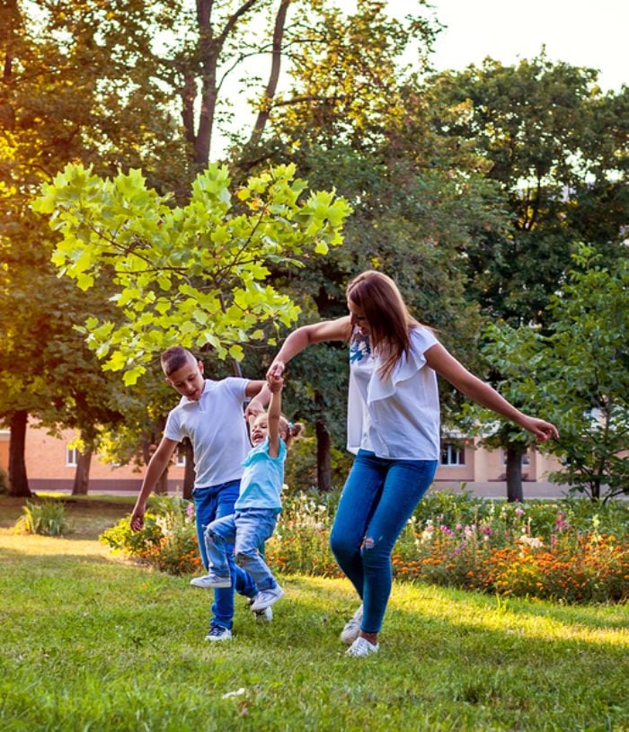 Happy family playing in the garden