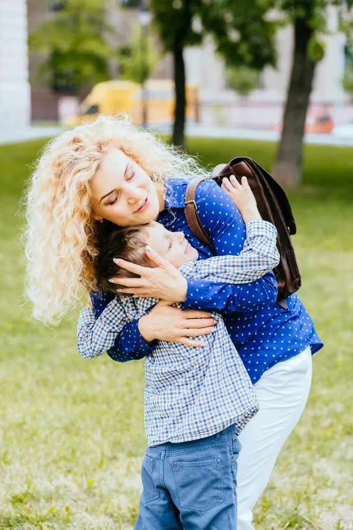 Mother and son hugging