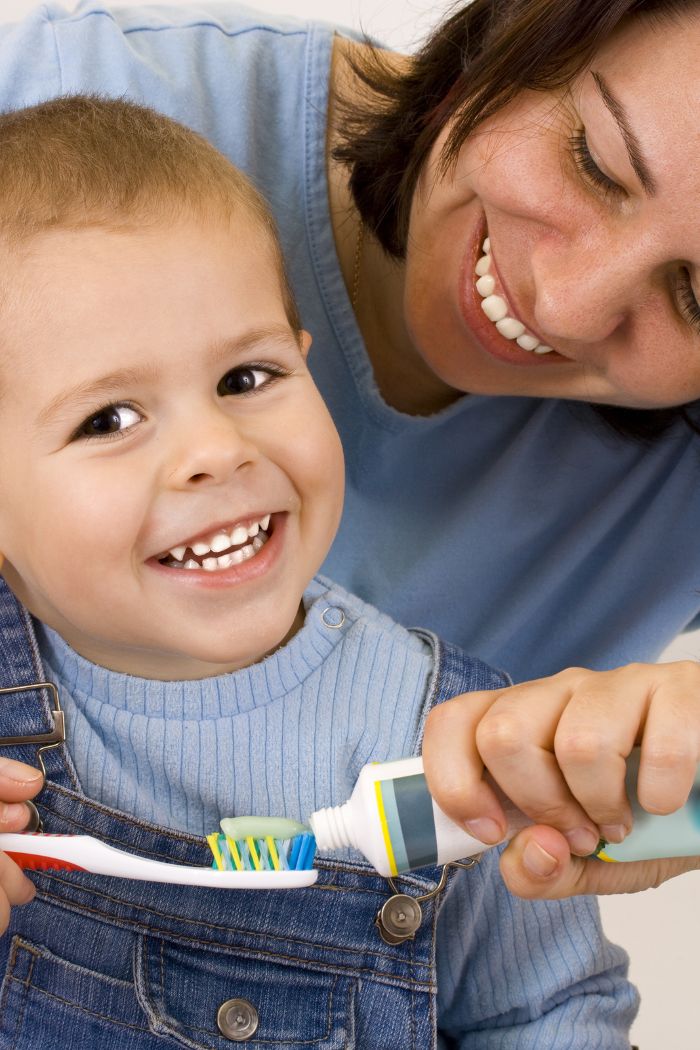 Child brushing his teeth