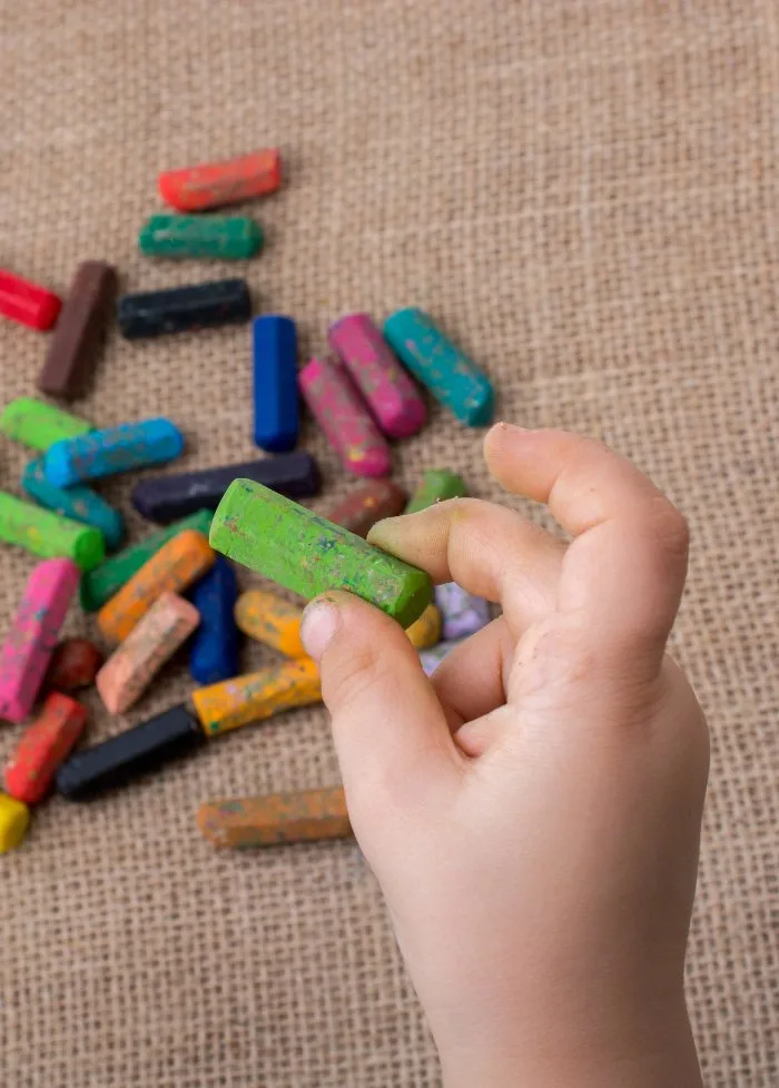 Child holding a crayon with good fine motor control