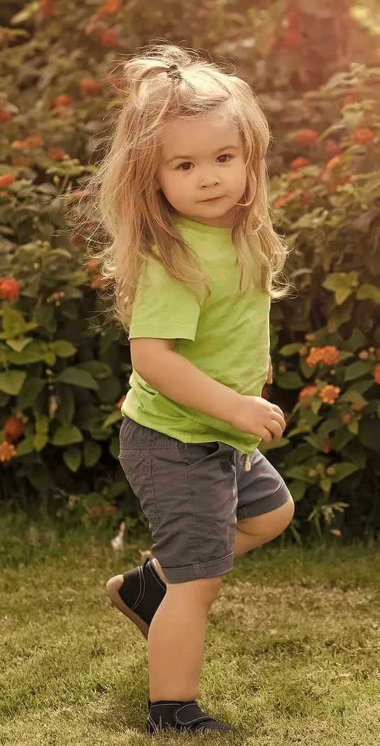 Child balancing on one leg