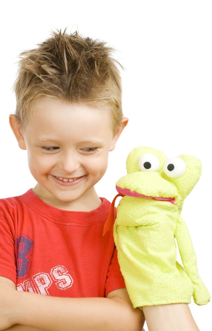 Boy playing with puppet