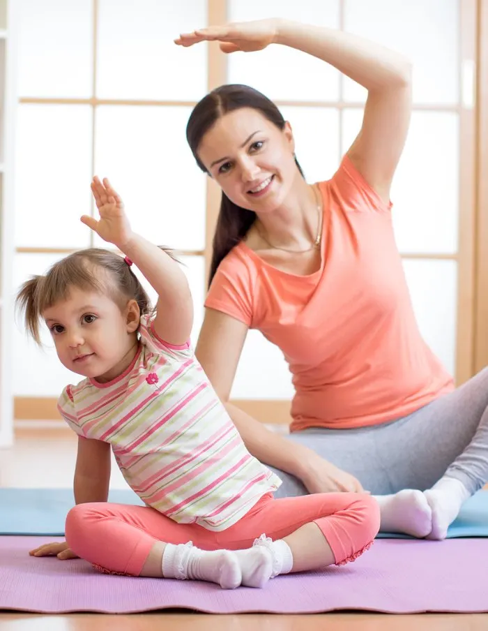 Mom and child doing yoga