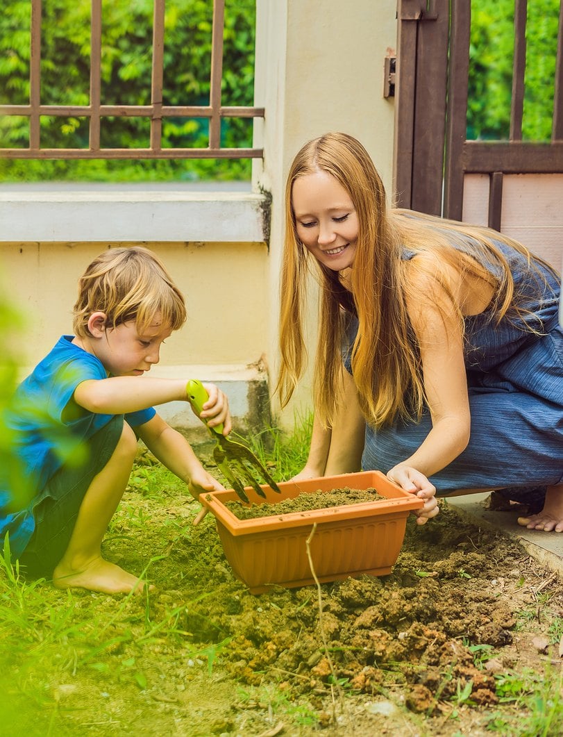 Mom and son gardening