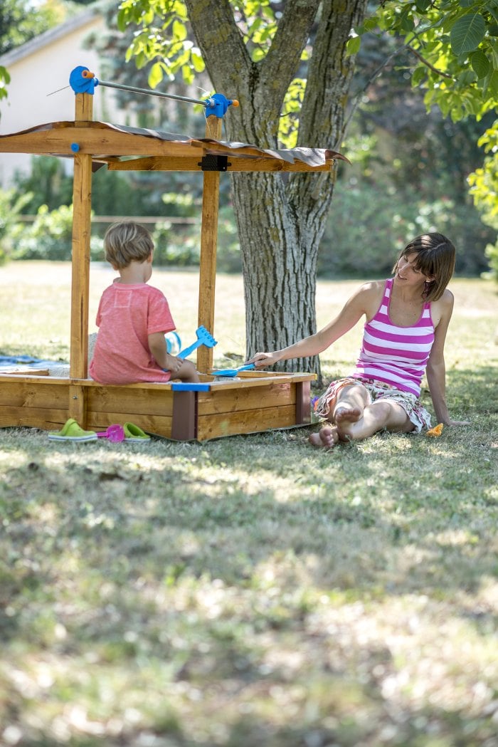 Sandpit under a tree