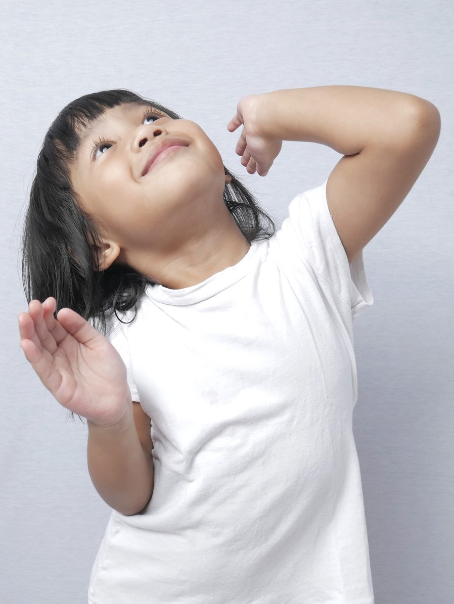 Child dancing as part of the simon says game