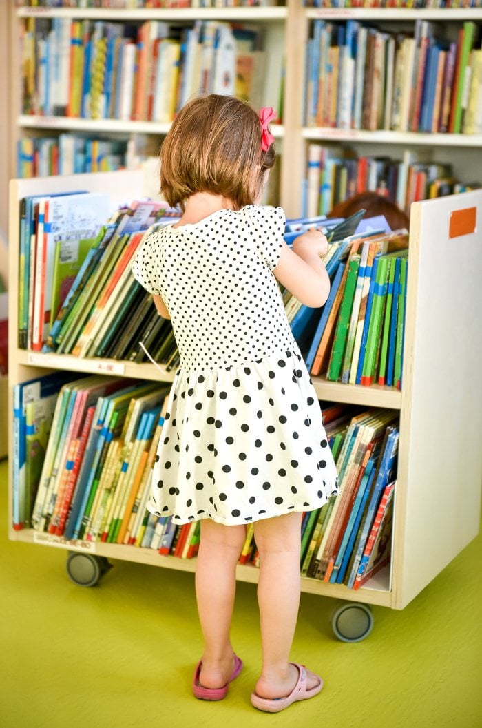 Child choosing a library book