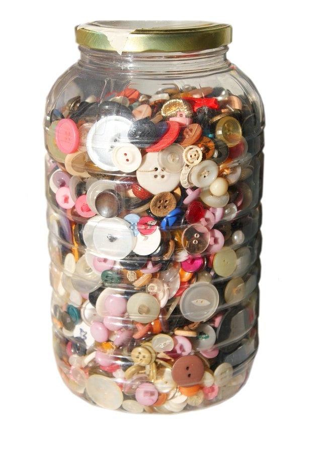 Glass jar filled with buttons