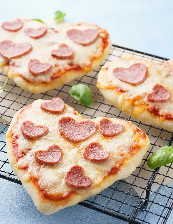 Mini heart-shaped pizzas