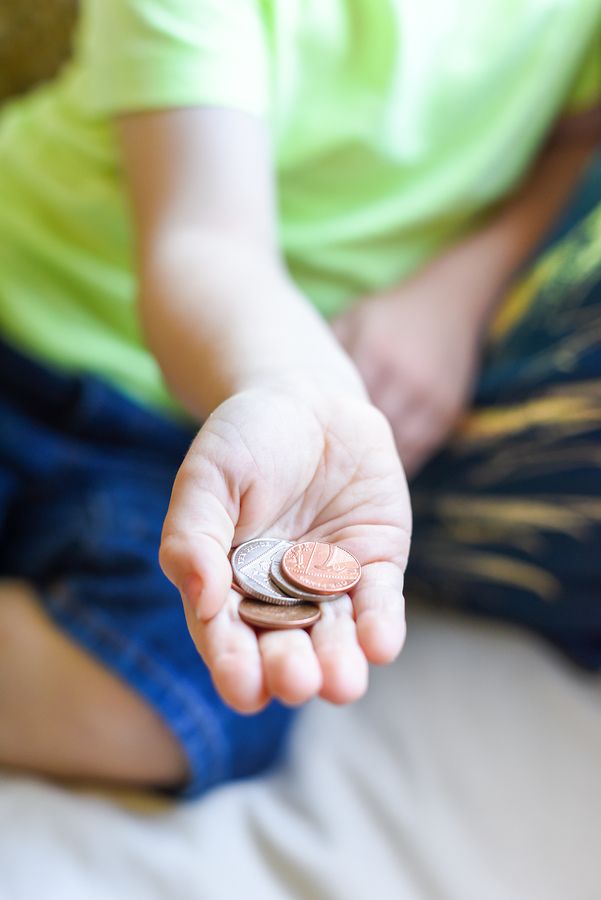 Child holding coins