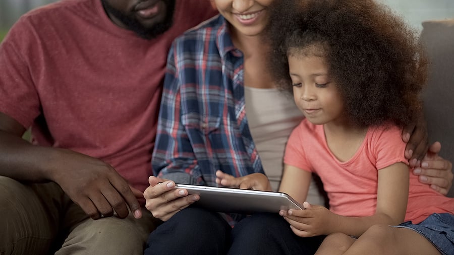 Parents spending time with preschooler