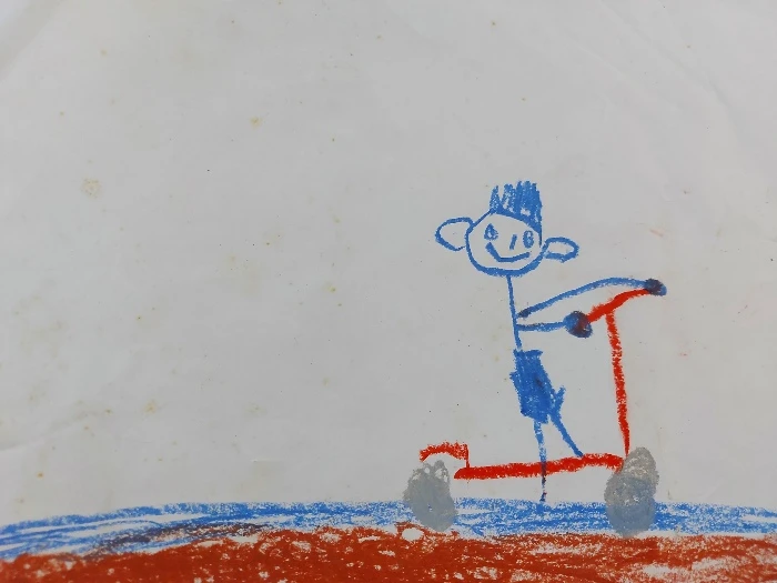 Child's drawing of himself on a scooter
