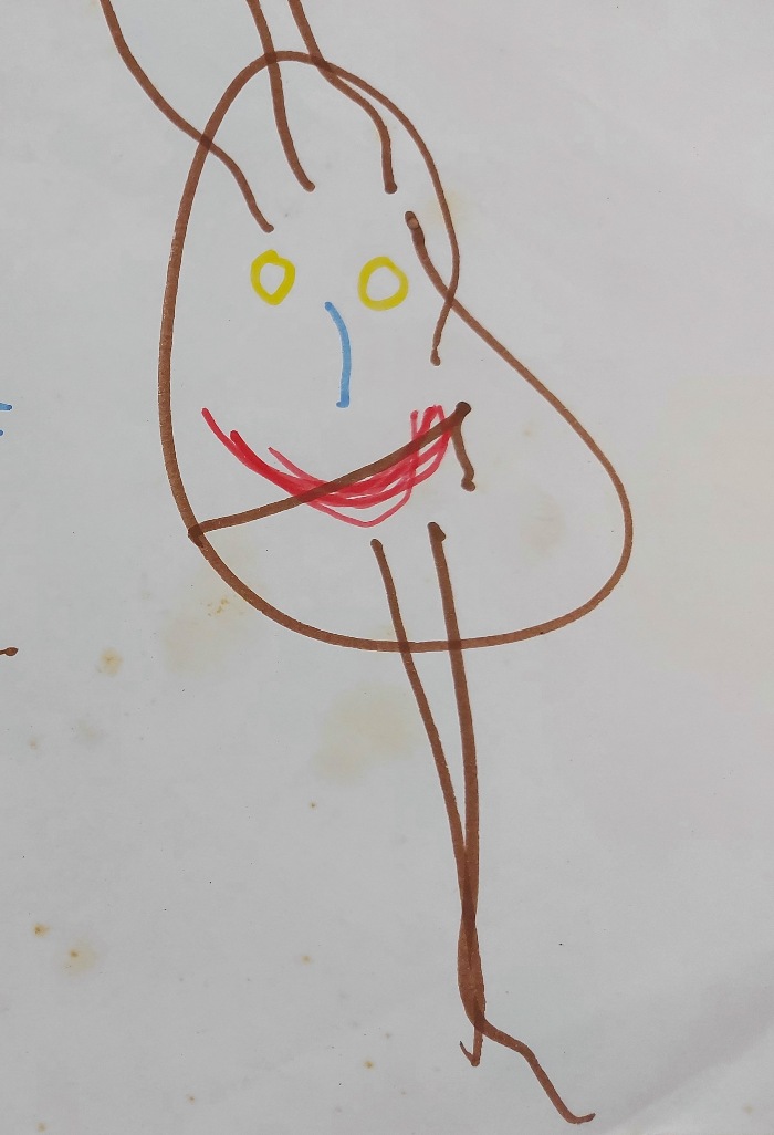 Child's drawing of a person with head and legs