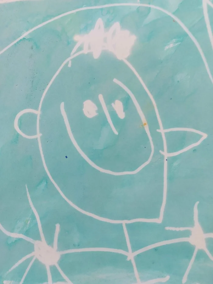 Child's drawing of person with details such as fingers, ears, etc.