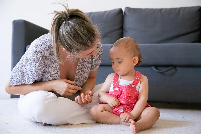 Mother talking to young toddler