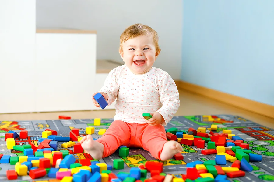 Little baby playing with blocks