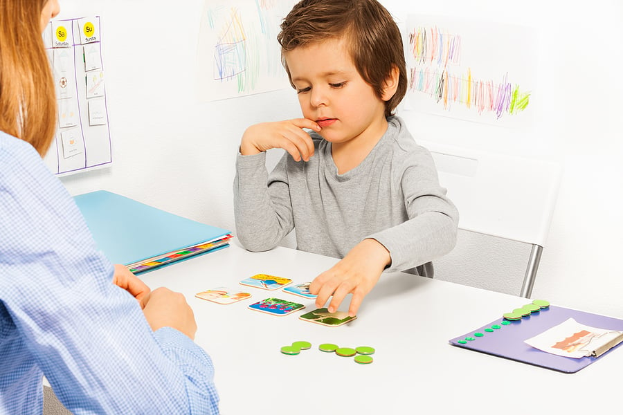 Child playing with matching cards