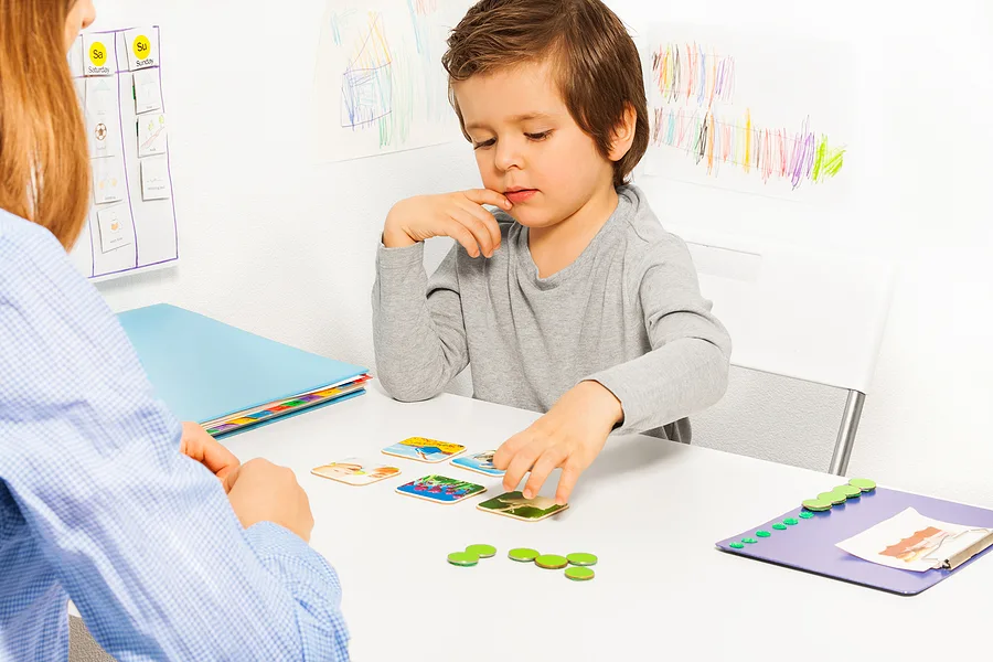 Child playing with matching cards