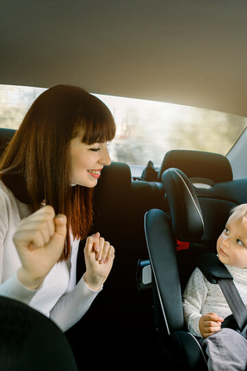 mom and child on a road trip playing a game