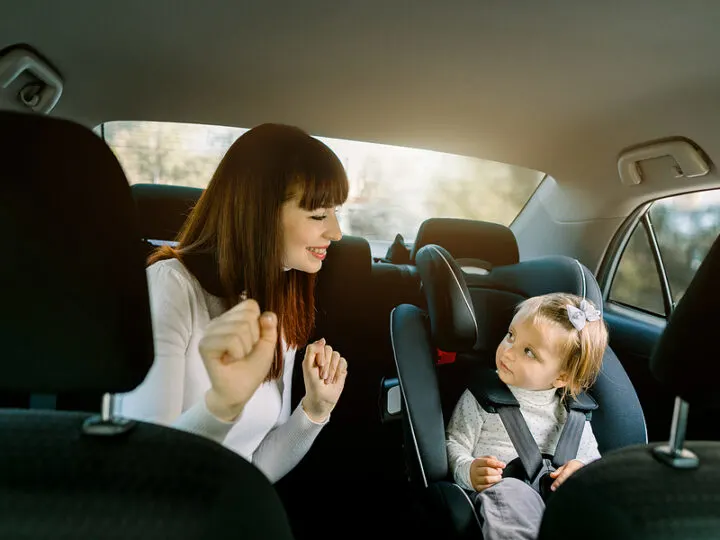 mom and child on a road trip playing a game