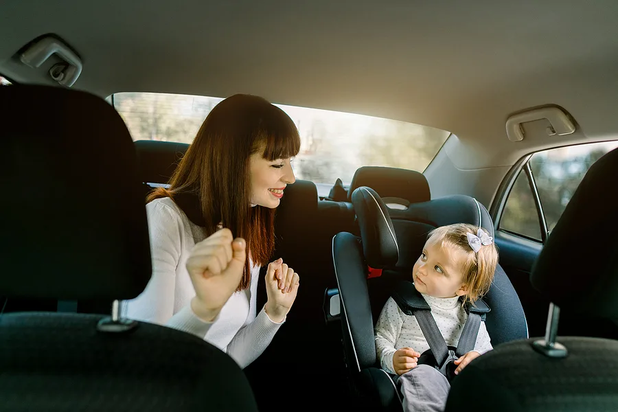 Mom and child on a road trip playing a game