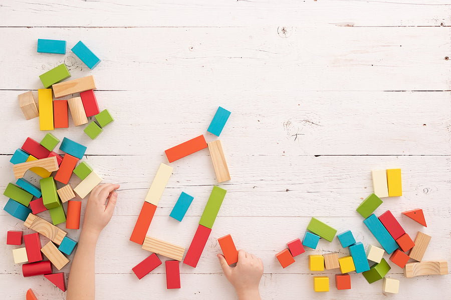 Child making shapes with blocks