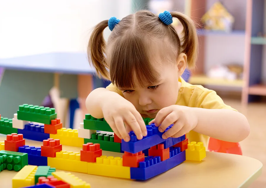 Child playing with legos