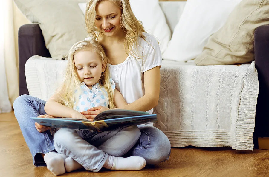 Mom reading a book to her child