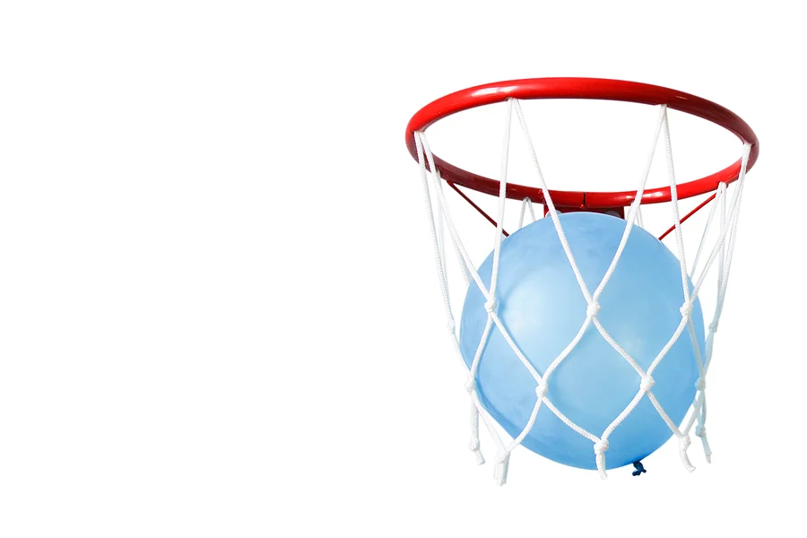 Balloon in a basketball hoop
