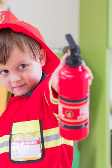 boy dressed up like a firefighter