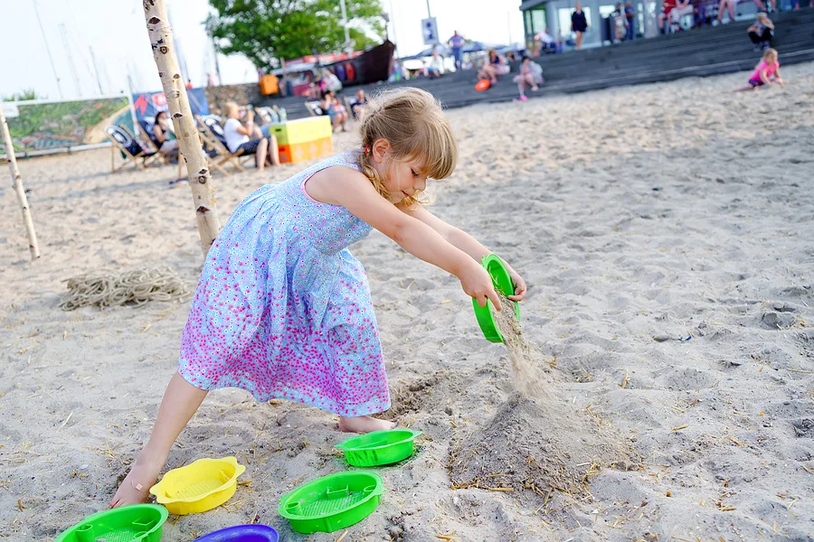 Little girl playing in sand