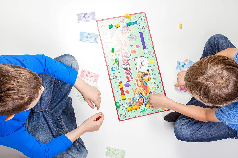 Two kids playing board games