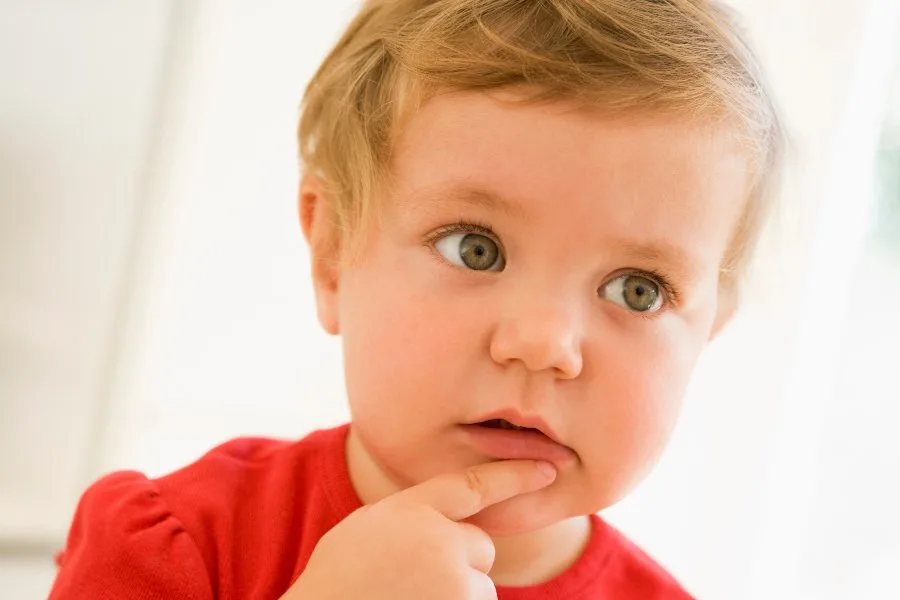 Toddler with a pensive look on face