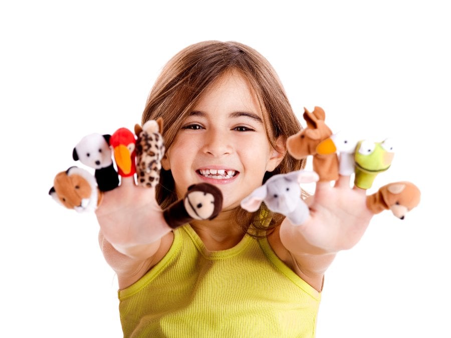 Preschooler showing animal finger puppets on all 10 fingers