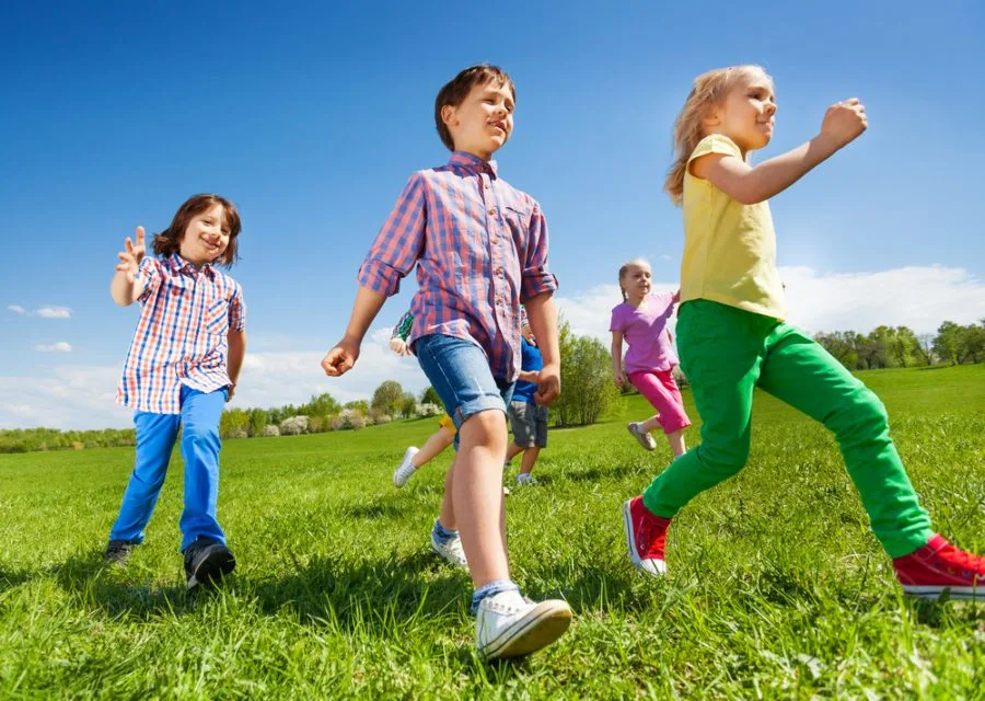 Children playing following the leader outside