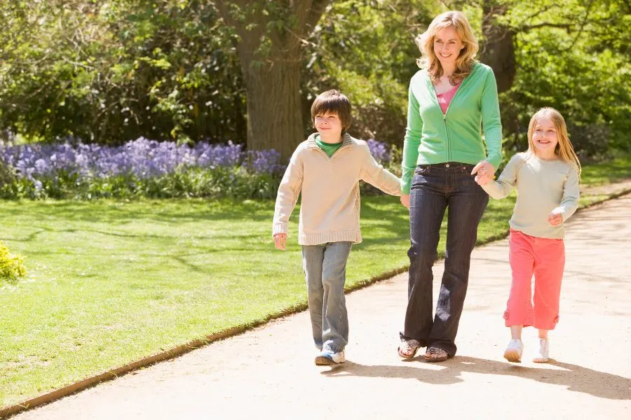 Mom and kids out on a walk in the park