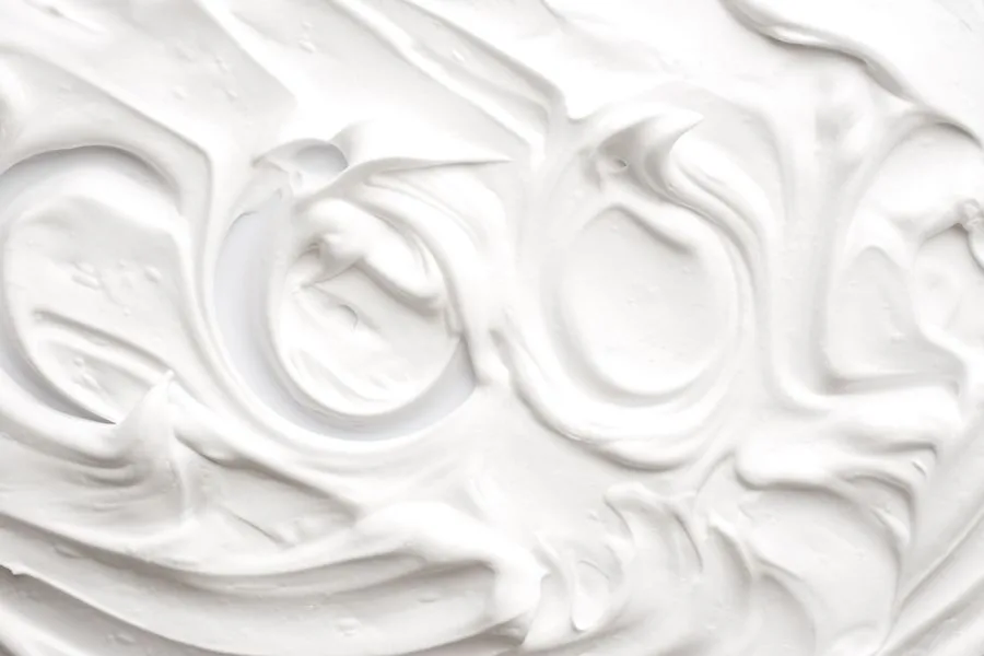 White shaving foam spread out with patterns in it