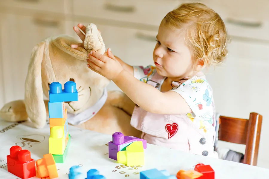 Toddler playing with Legos