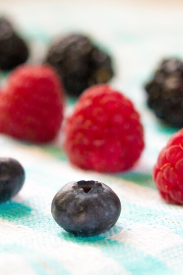 blueberries and raspberries in lines next to each other