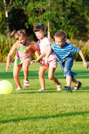children running with a ball