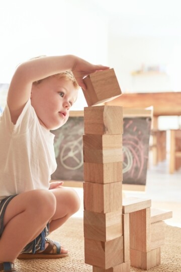 Little boy stacking blocks